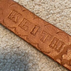 NWOT Leather snap bracelet with KEITH imprint.
